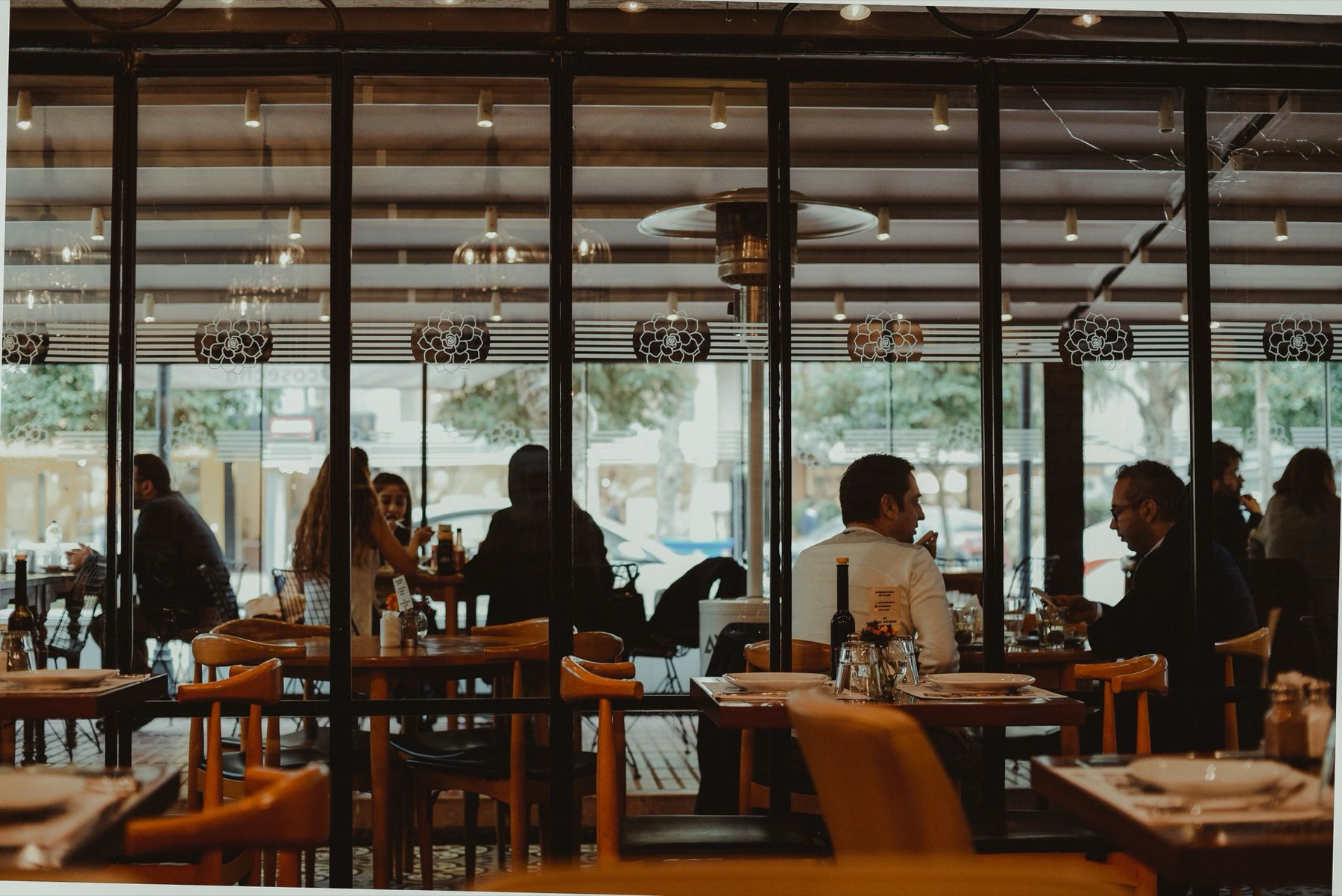 Guests enjoying an evening at a lively restaurant